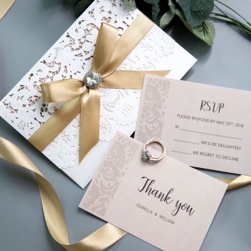 Ivory Laser Cut Wedding Invitations with Gold Shimmer Ribbon and Diamante WS002