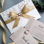 Exclusive Ivory  Laser Cut Wedding Invitation with blush pink paper and  Crystal Button Ribbon Bow WS002