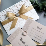 Exclusive Ivory  Laser Cut Wedding Invitation with blush pink paper and  Crystal Button Ribbon Bow WS002