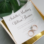 Fabulous Rose Gold  Laser Cut Wedding Invitation with Glittery Navy Ribbon Bow and Gold Mirror Paper Backer WS003