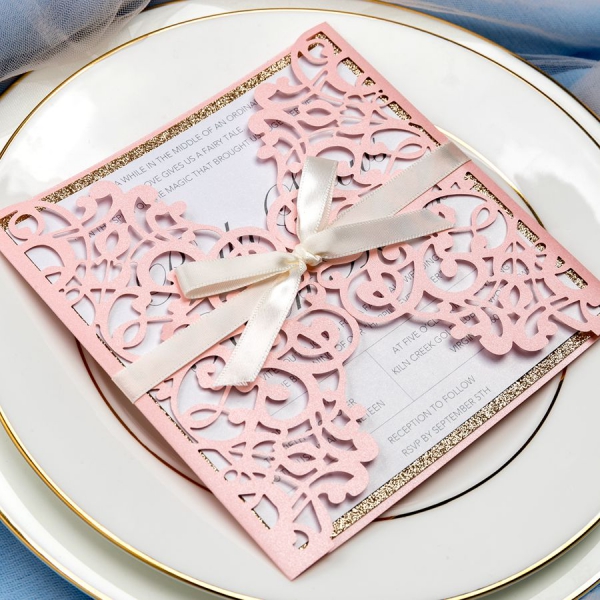 /1067237-3023-thickbox/romantic-blush-pink-laser-cut-wedding-invitations-with-ivory-ribbon-and-gold-glitter-backer-elegant-invites-champagne-gold-luxurious-fall-spring-square-ws066.jpg