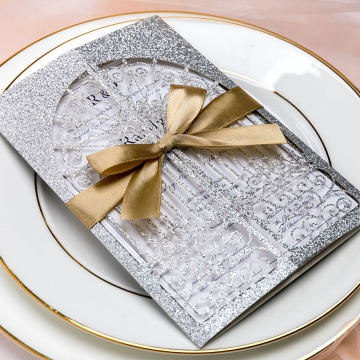 Silver shimmer laser cut wedding invitations with gold ribbon WS081