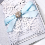 Silver and white laser cut invitation, turquoise ribbon, spring and summer, winter, wonderland, whimsical 